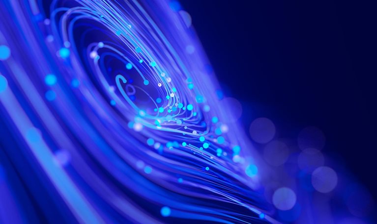 Abstract blue and purple fiber-optic strands curve around glowing cyan points of light.