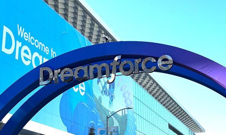 Entrance to Dreamforce, with a large blue arch and “Dreamforce” signage outside the conference venue.