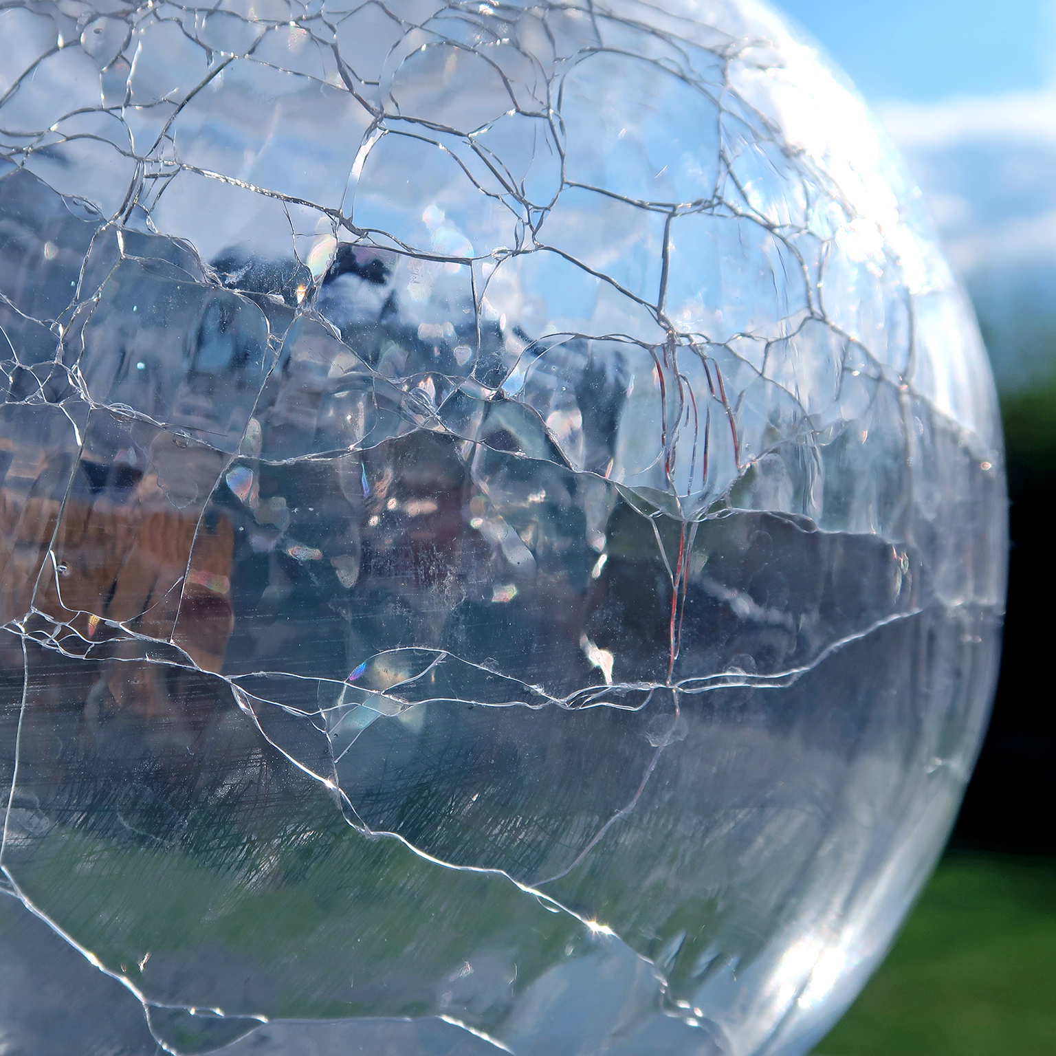 Cracked glass vase. Refracted, reflected and distorted light. Abstract background