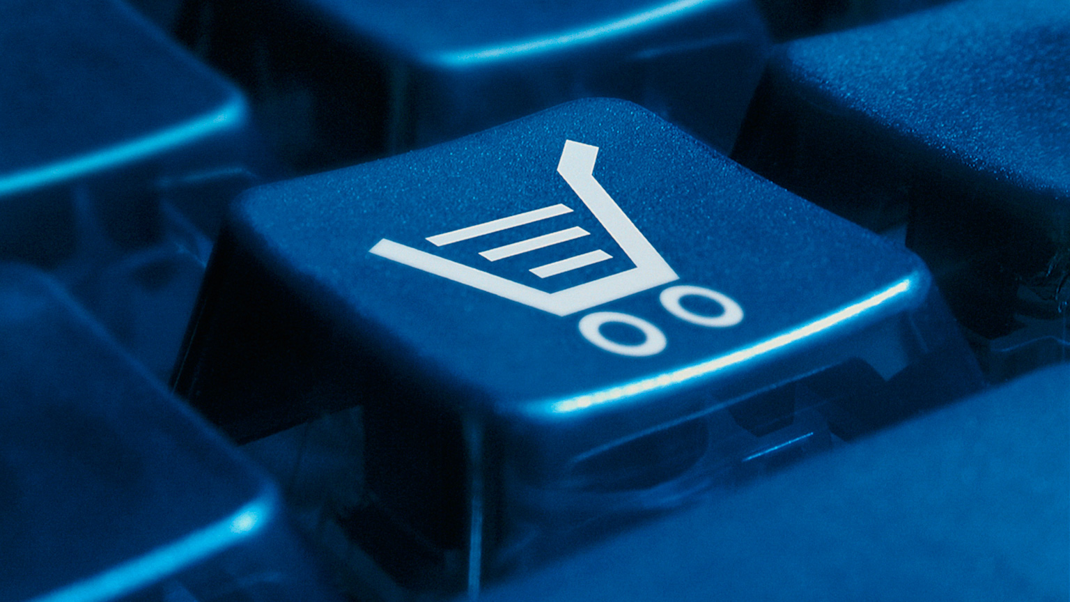 Photograph of a keyboard with an icon of a shopping cart on a button