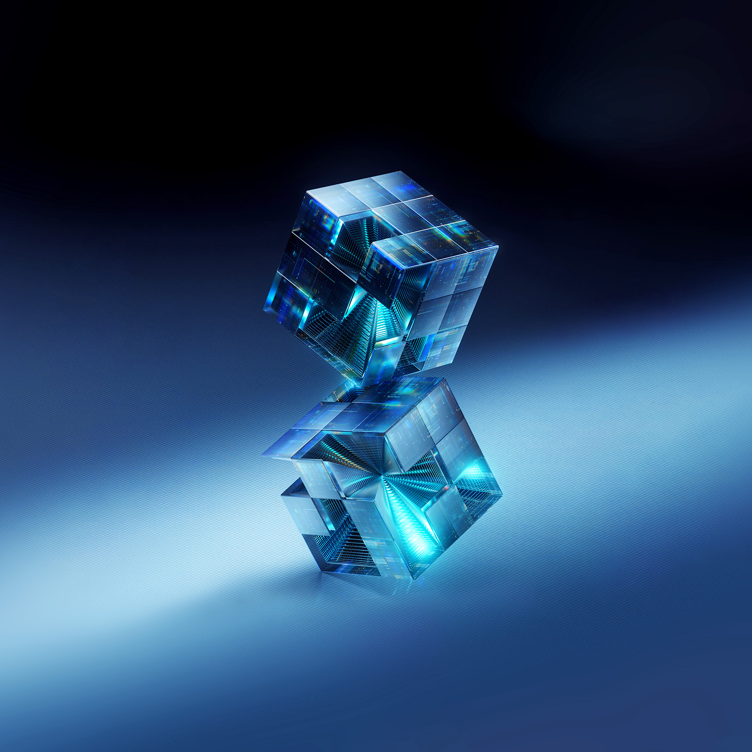 Image of two 3D translucent cubes with intricate internal structures and glowing blue light floating against a dark blue background.