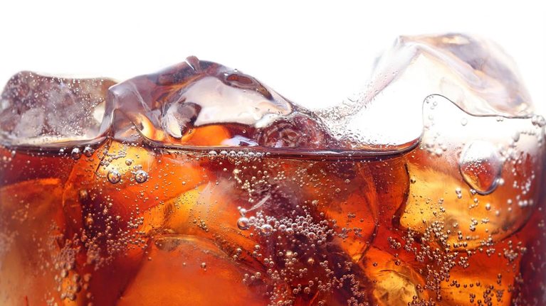Background of cola with ice and bubbles