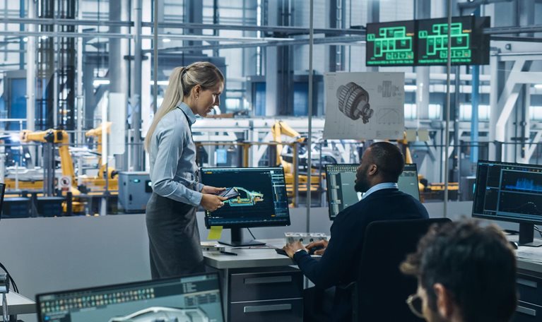 Car Factory: Team of Automotive Engineers Working, Using Computers to Design Advanced 3D Models for High-Tech Engines. Automated Robot Arm Industrial Assembly Line Manufacturing Electric Vehicles - stock photo