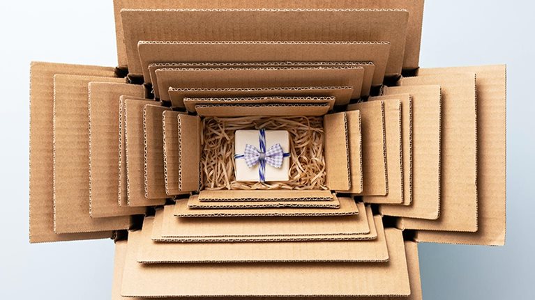 Small Gift Packed in Multiple Cardboard Boxes Nesting, Excessive Packaging