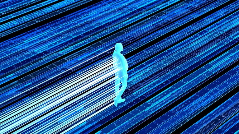A glowing, silhouetted human figure walking along streaks of bright blue and white light that resemble data streams or digital pathways.