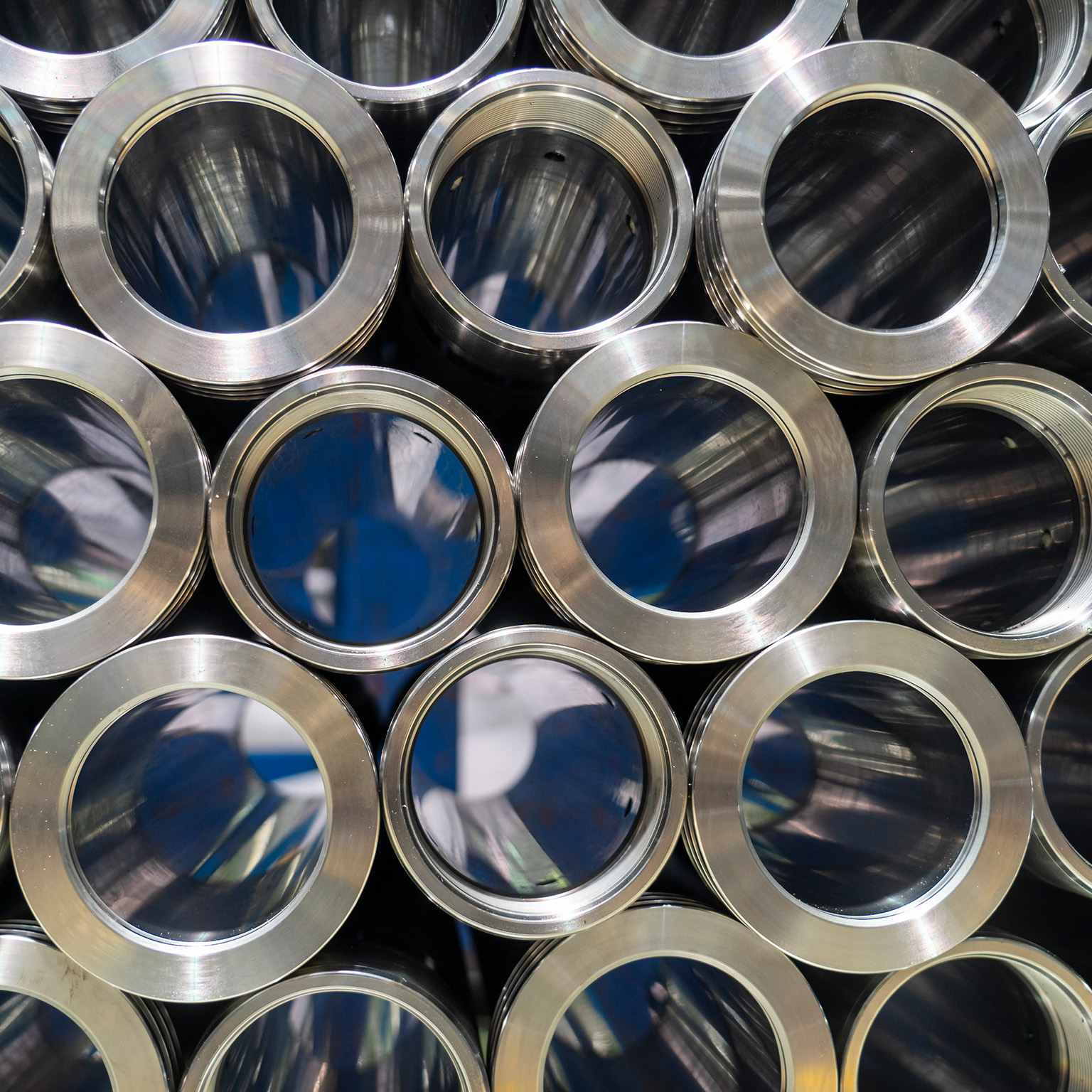 Rolls of metal pipe fittings during machining