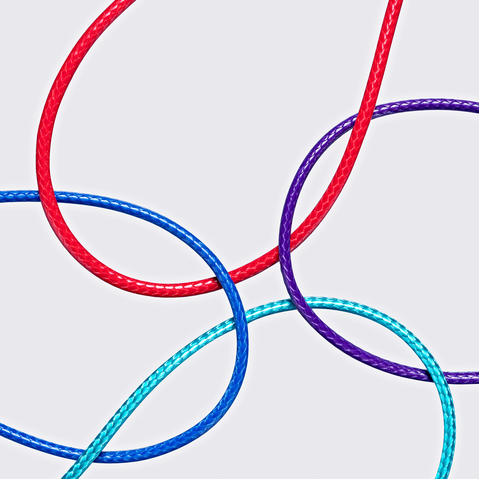 Four different color ropes crossed and converged together