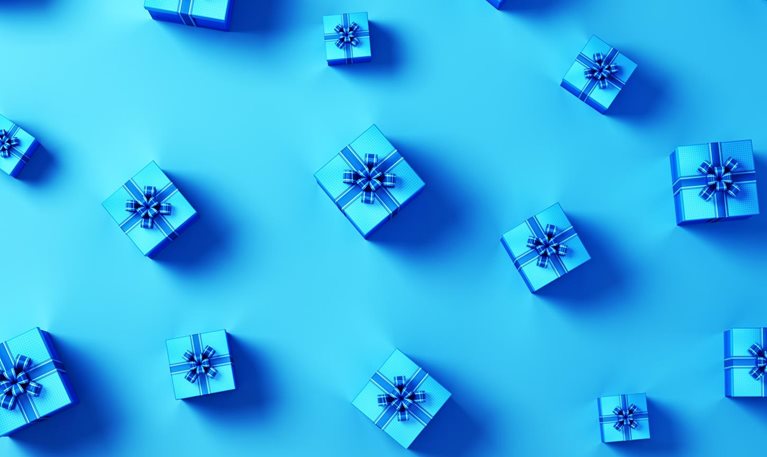 An image of blue gift boxes with blue ribbons.