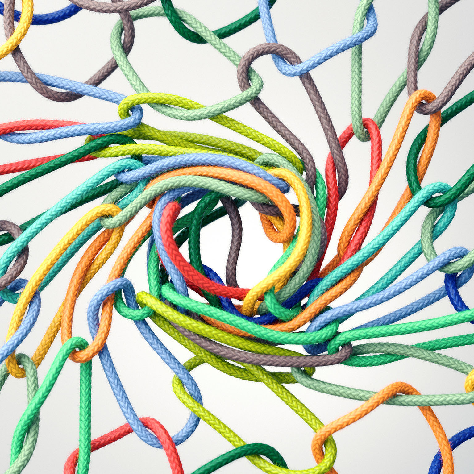 Multicolored rope rings linking together to form a vortex in the center