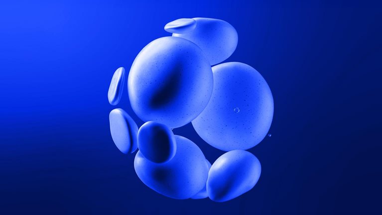 A cluster of smooth, blue, rock-like shapes seemingly floating against a deep blue background. The shapes vary slightly in size and are clustered together, creating a visually interesting, abstract form.