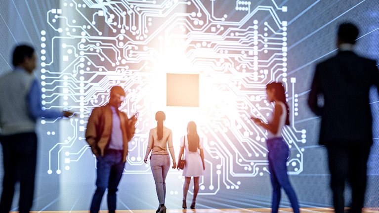 A diverse group of people is shown in a futuristic, digital environment, walking towards a large, glowing graphic of a circuit board.
