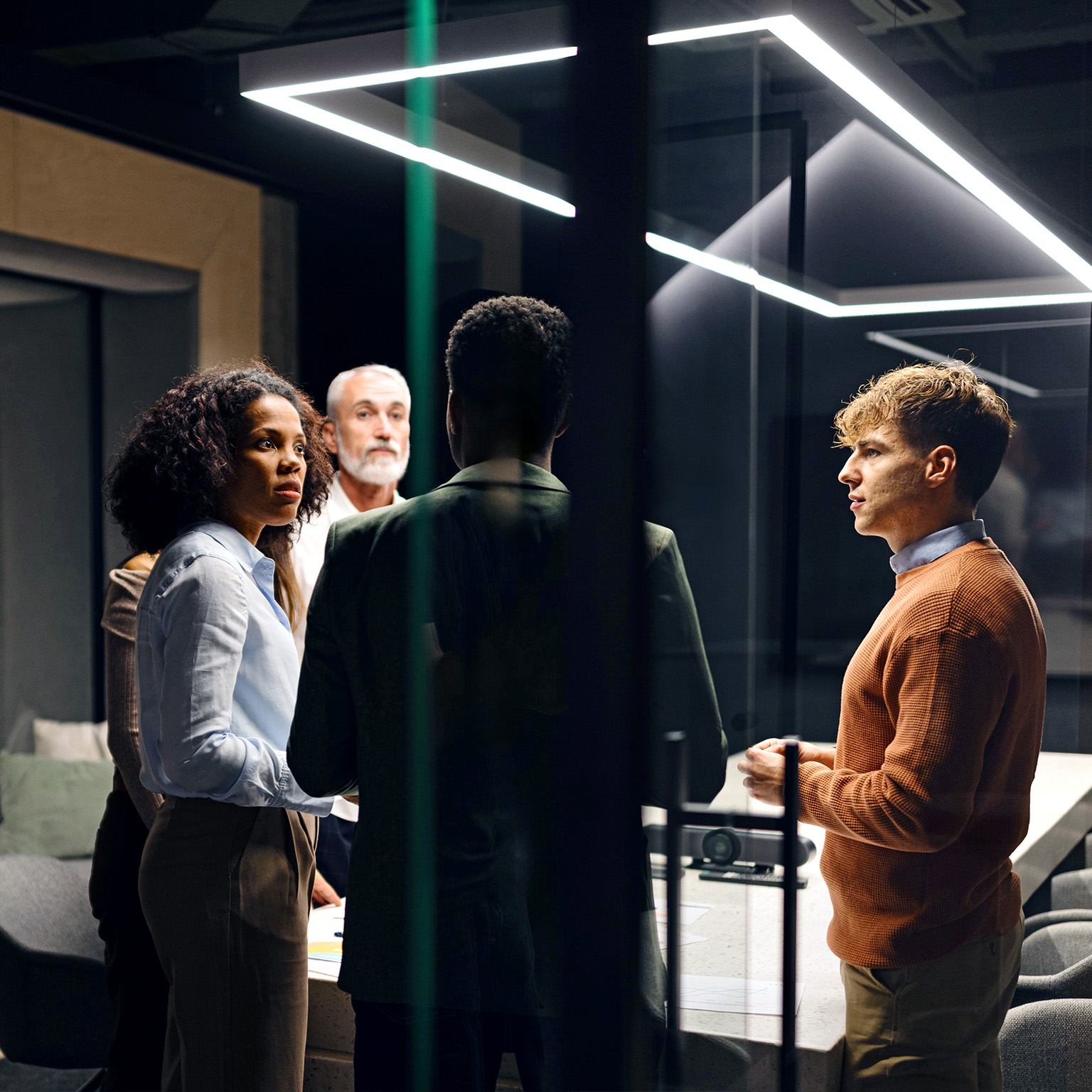 Group of business professionals having a discussion in a private meeting room