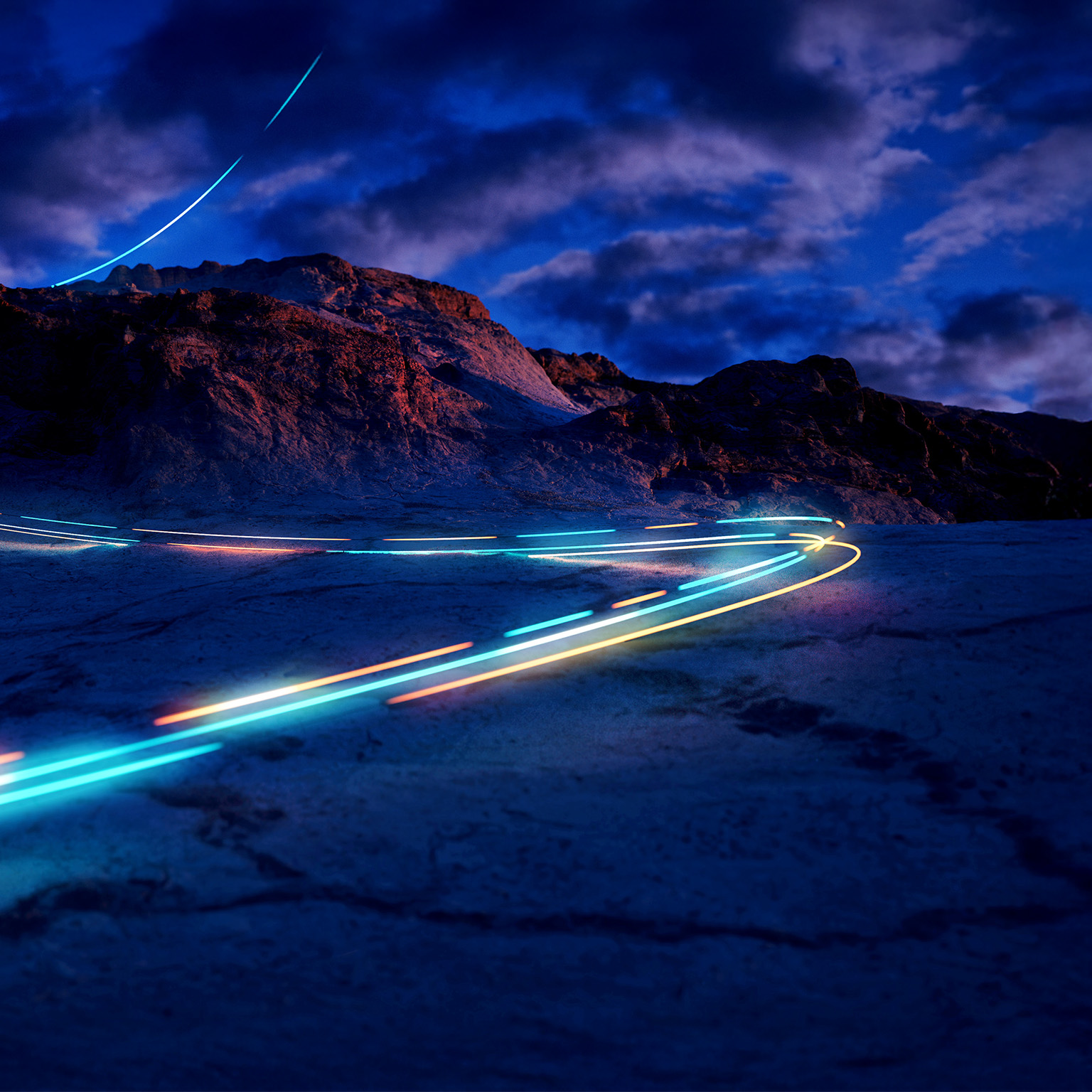 A mysterious light trail descending a mountain slope