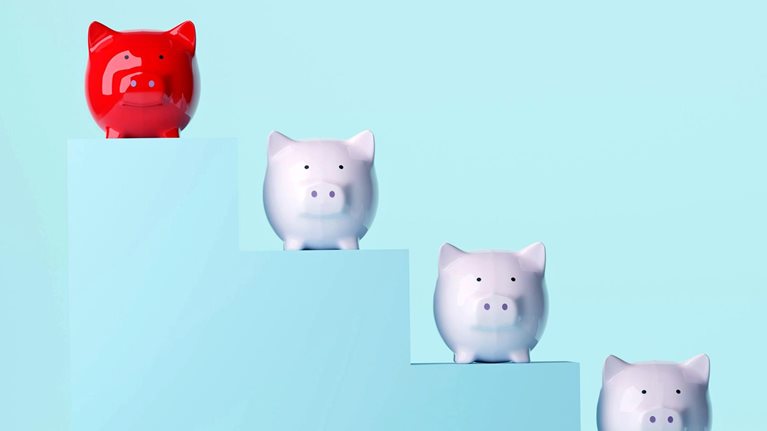Five piggy banks descend along steps, with a red piggy bank standing apart at the top.