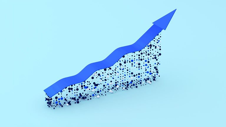 A blue arrow trending upwards symbolizes growth. The arrow appears to be constructed on a foundation of small blue, black, and white spheres, creating a dynamic and textured effect.