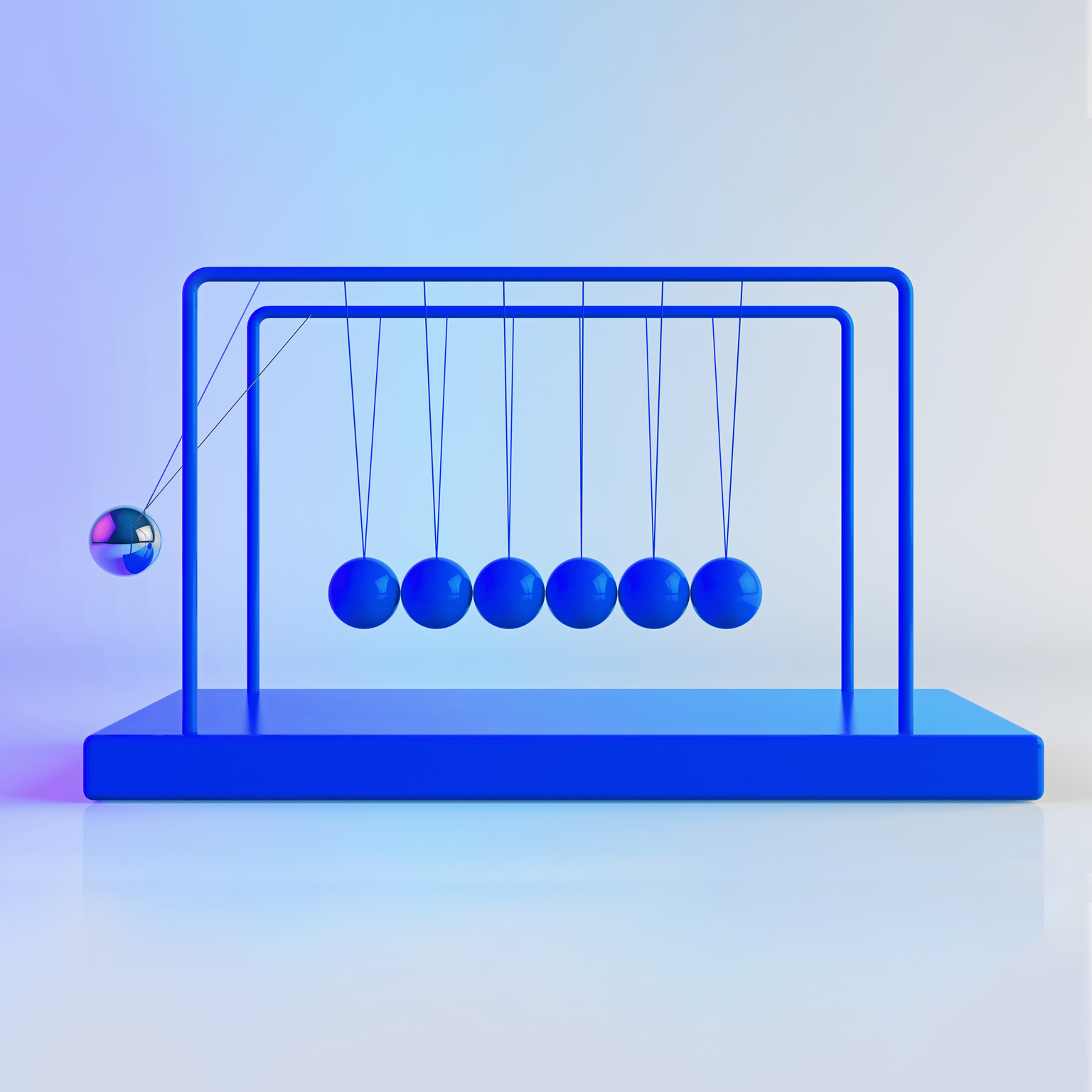 Newton's Cradle, with shiny, metallic balancing balls. Six remain still as one is in motion. 
