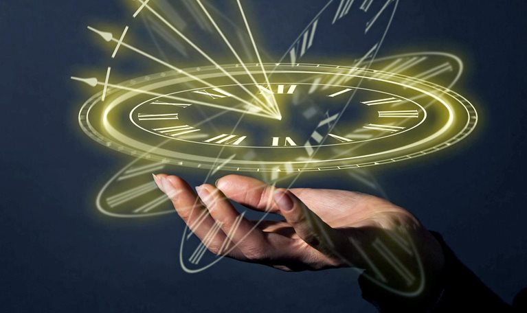 A glowing clock floats above an open palm.