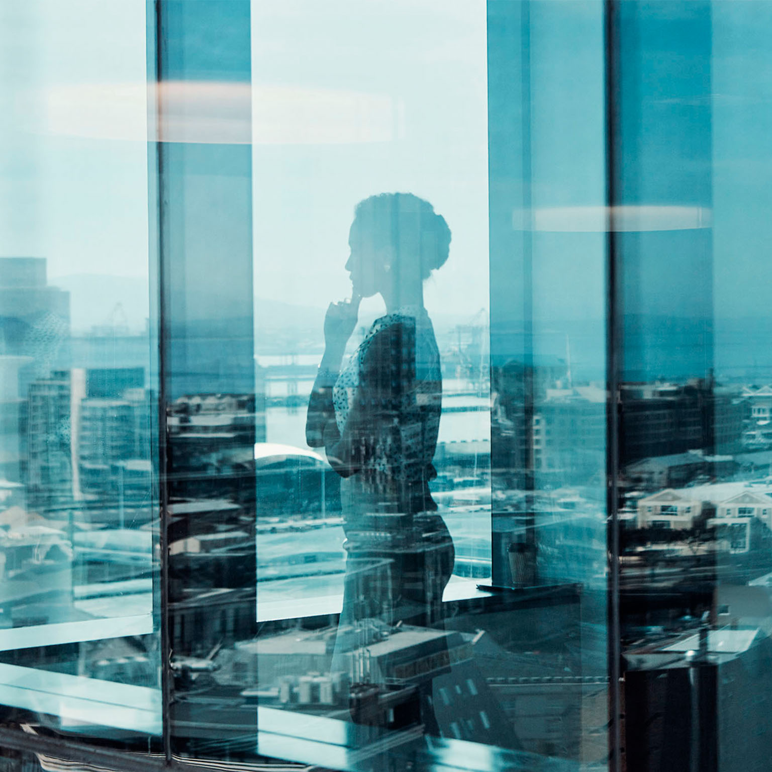 Person looking out office window