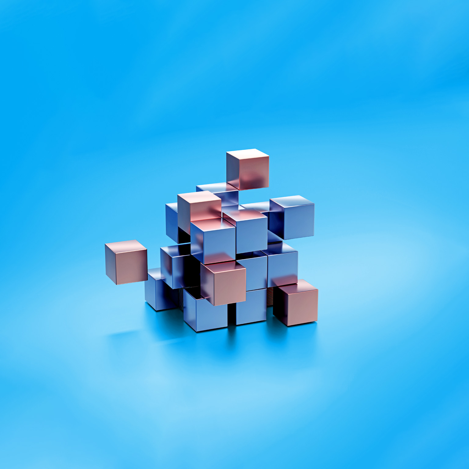 Metal cubes made of silver and gold coming together to form a bigger cube.