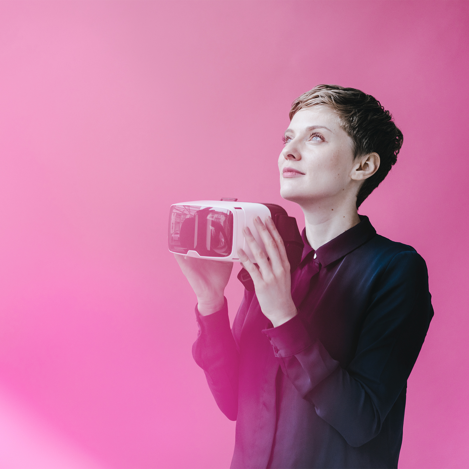 Woman holding VR glasses