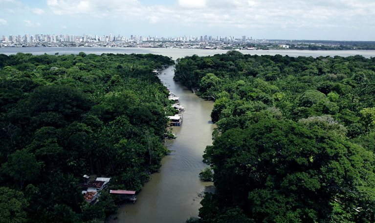 Aerial video that shows a river in the Amazon forest leading to the city of Belem, Brazil.