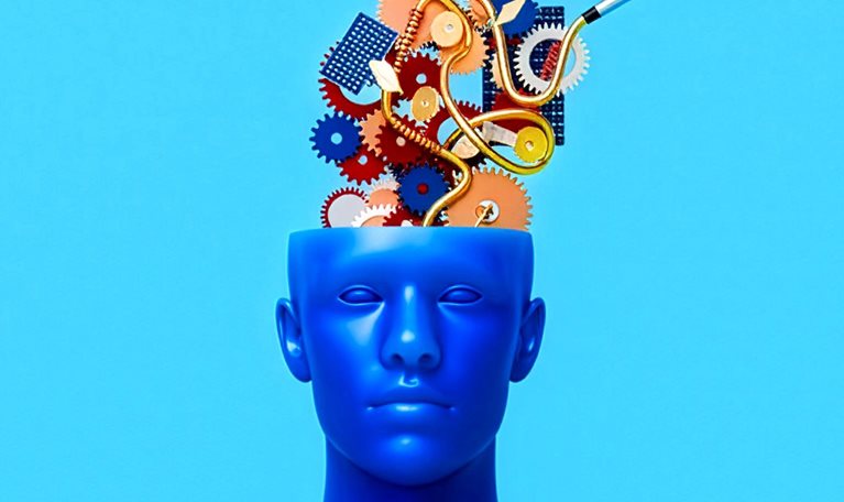 3D illustration of a bright blue human head with its top open, revealing a cluster of colorful interlocking gears, springs, and curved metallic tubes