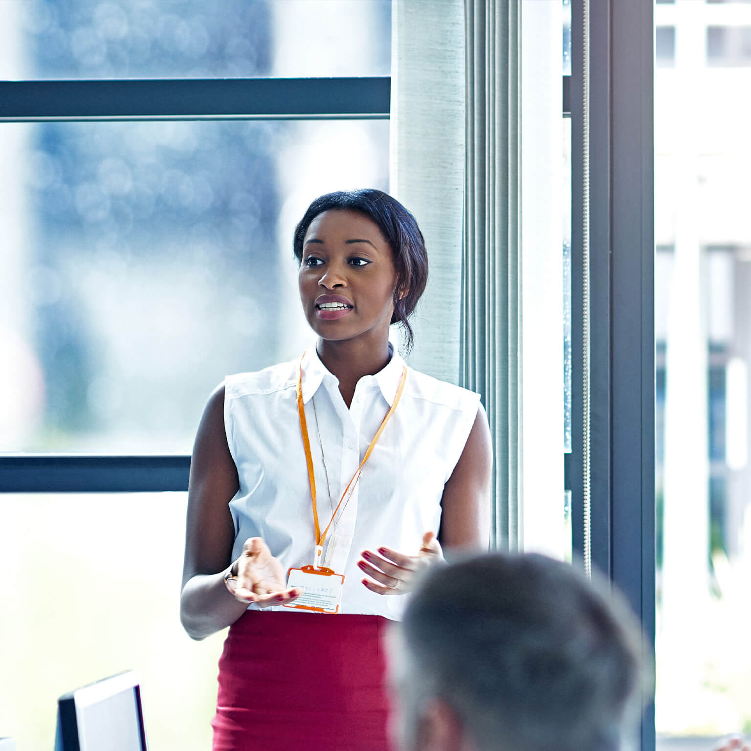 Businesswomen discussing a project with colleagues - stock photo