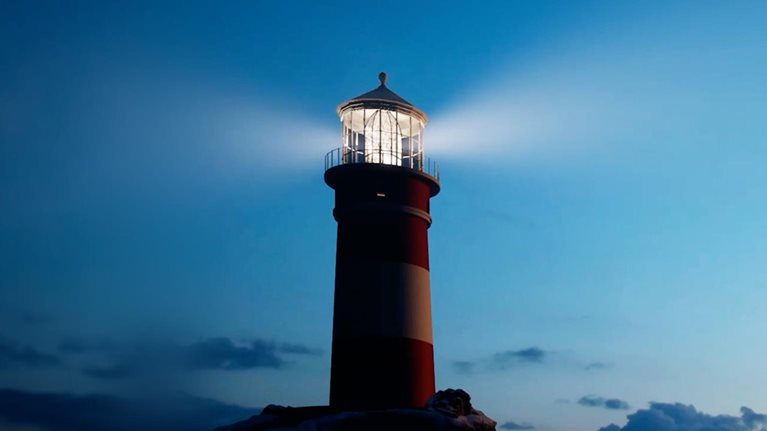 This image depicts a tall lighthouse with a prominent red and white striped pattern against a dark blue sky. The structure is situated on a dark, rocky foundation at the water's edge. The lighthouse is actively shining a bright, focused beam of light from its top lantern room.