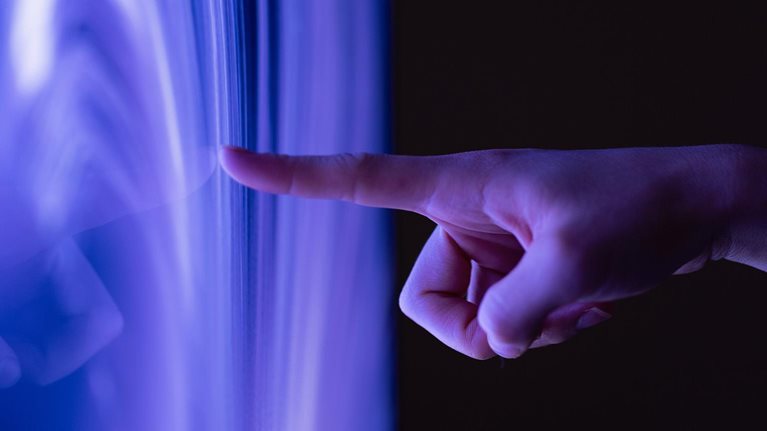 Connect to the future, Close-up of extended finger clicking computer screen