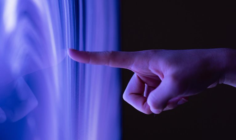Connect to the future, Close-up of extended finger clicking computer screen