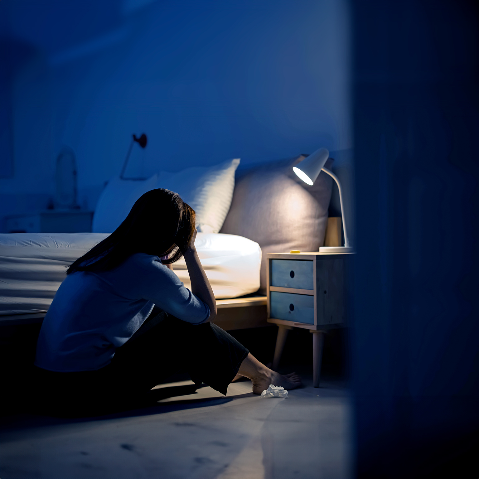crying asian woman feel depressed in the bedroom at home - stock photo