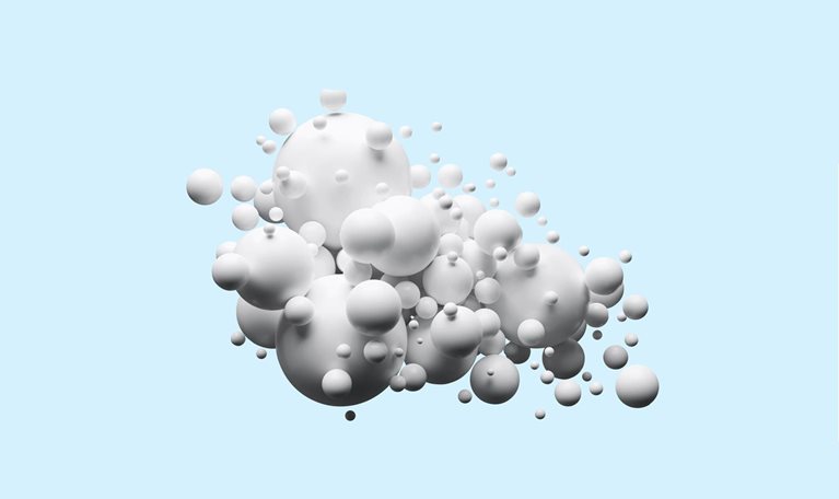 Group of white spheres on light blue background