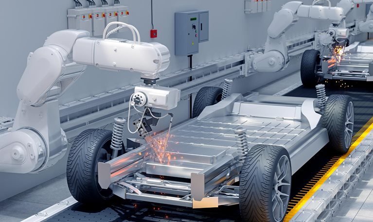 Close-up View Of Robot Arms Assembling Cars In Car Factory