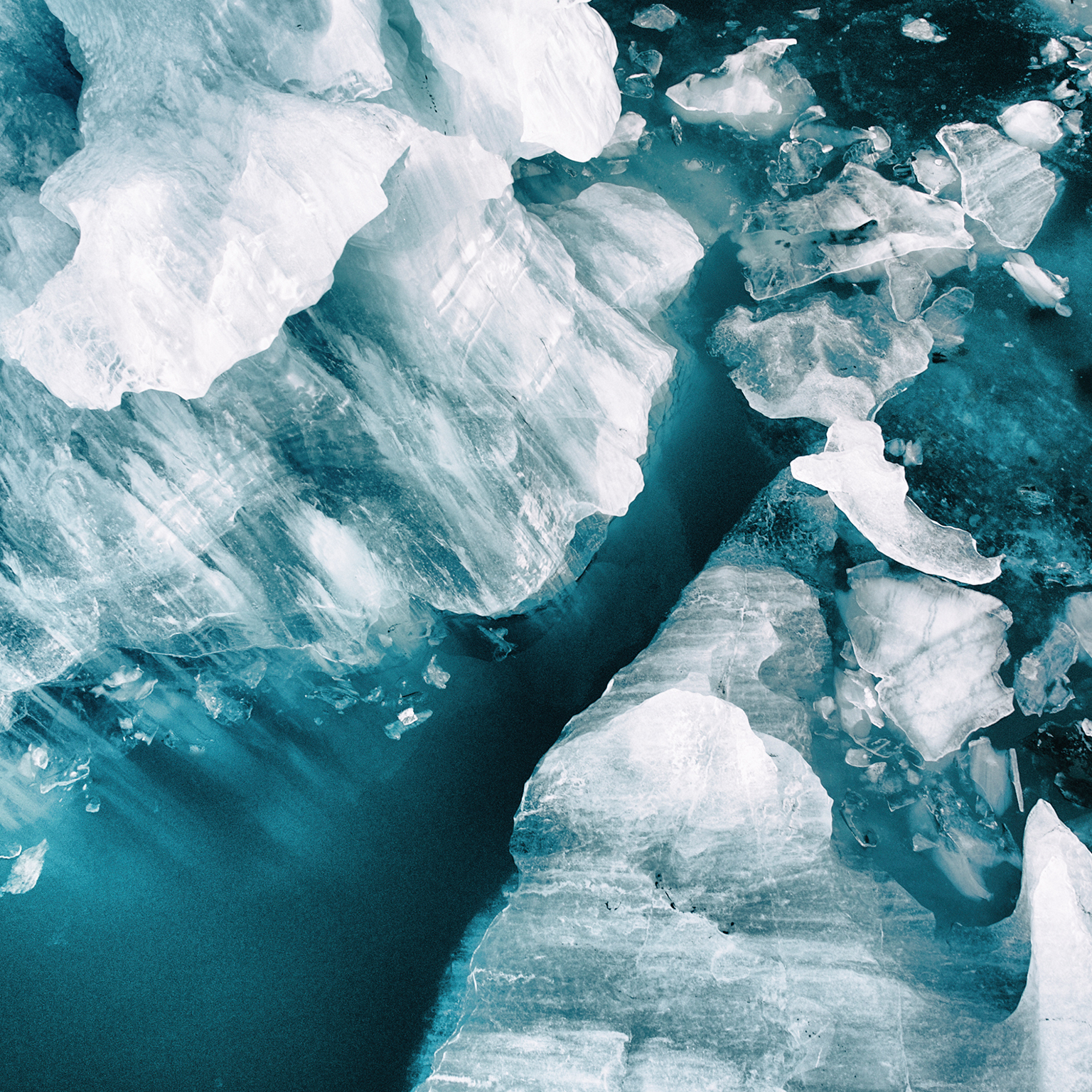 Small icebergs broken off from the large glacier at Vatnajökull, Iceland. Image was taken with a drone.