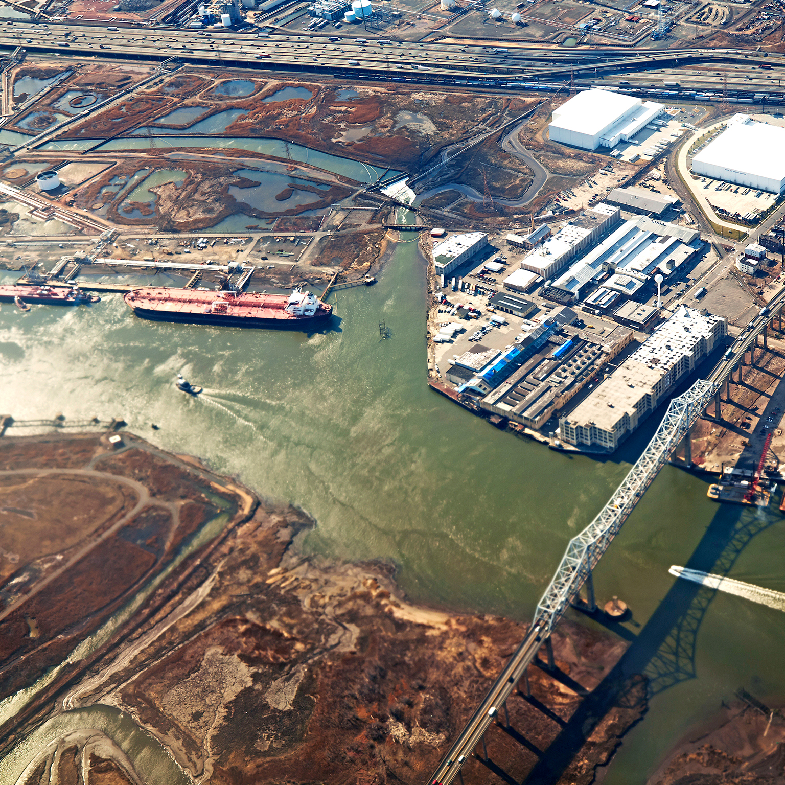 Aerial view of urban landscape with river and industry