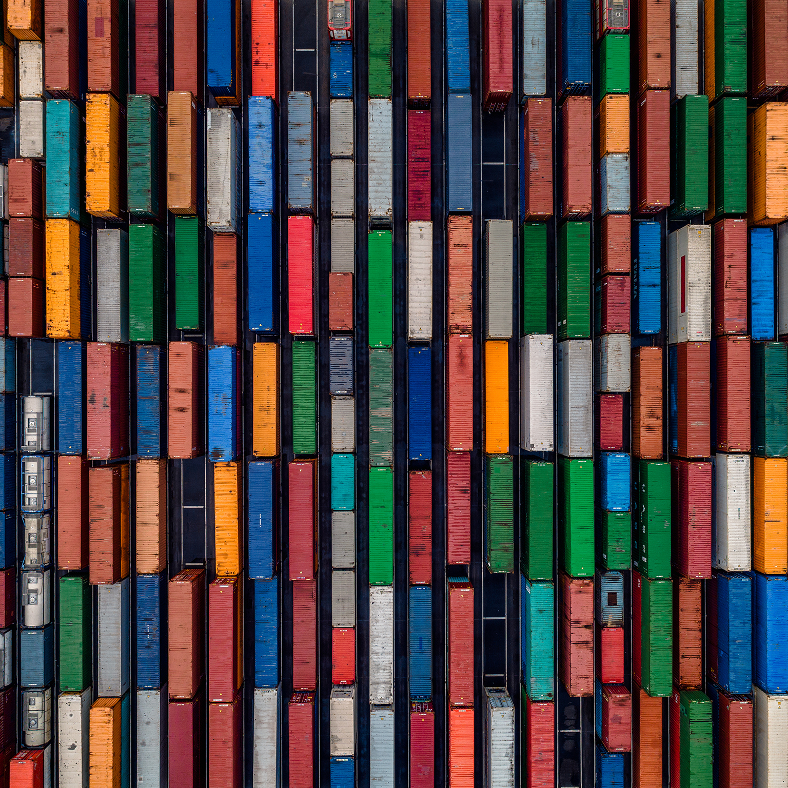 Aerial shot directly above multi coloured shipping crates, France - stock photo