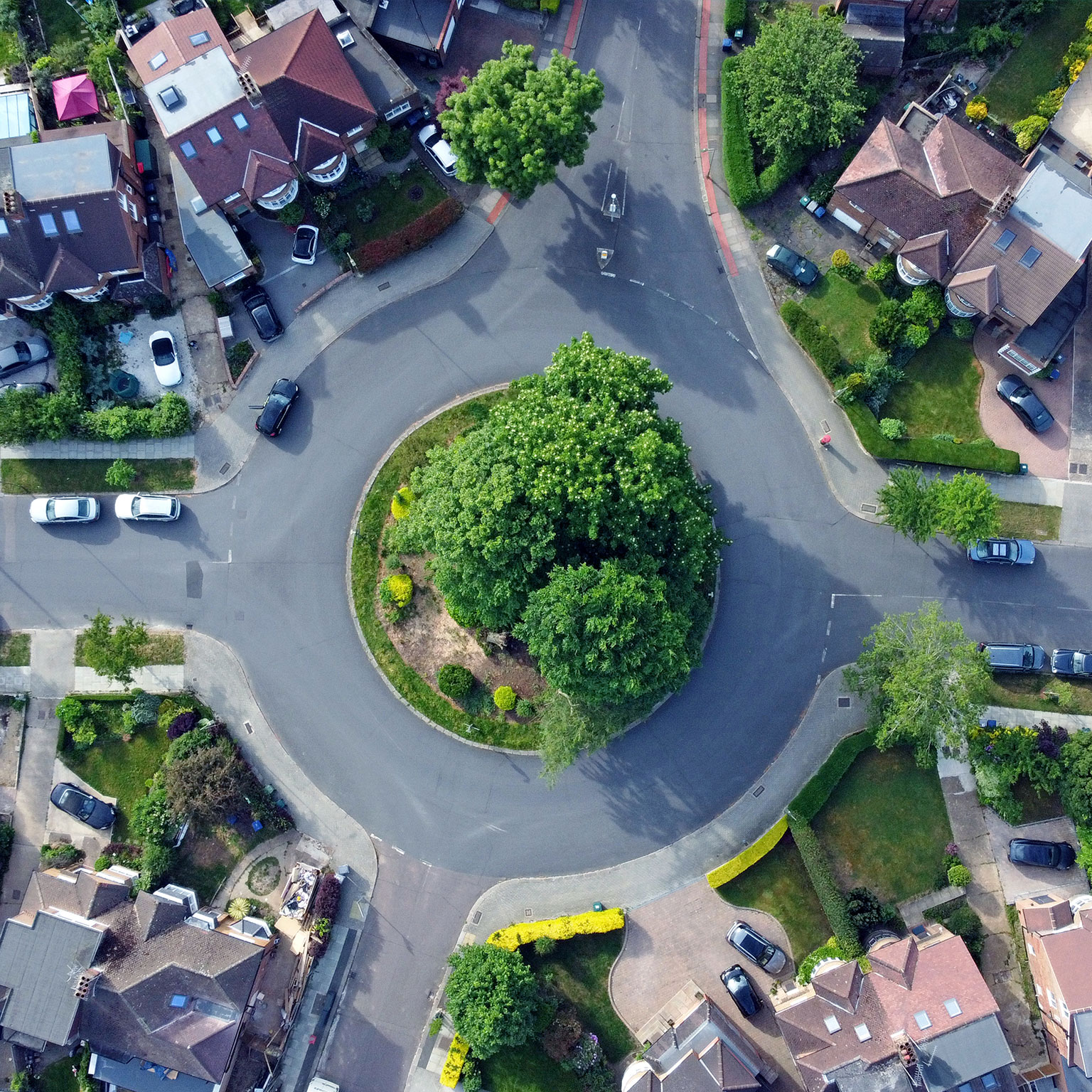 Overhead aerial view of a roundabout and residential housing