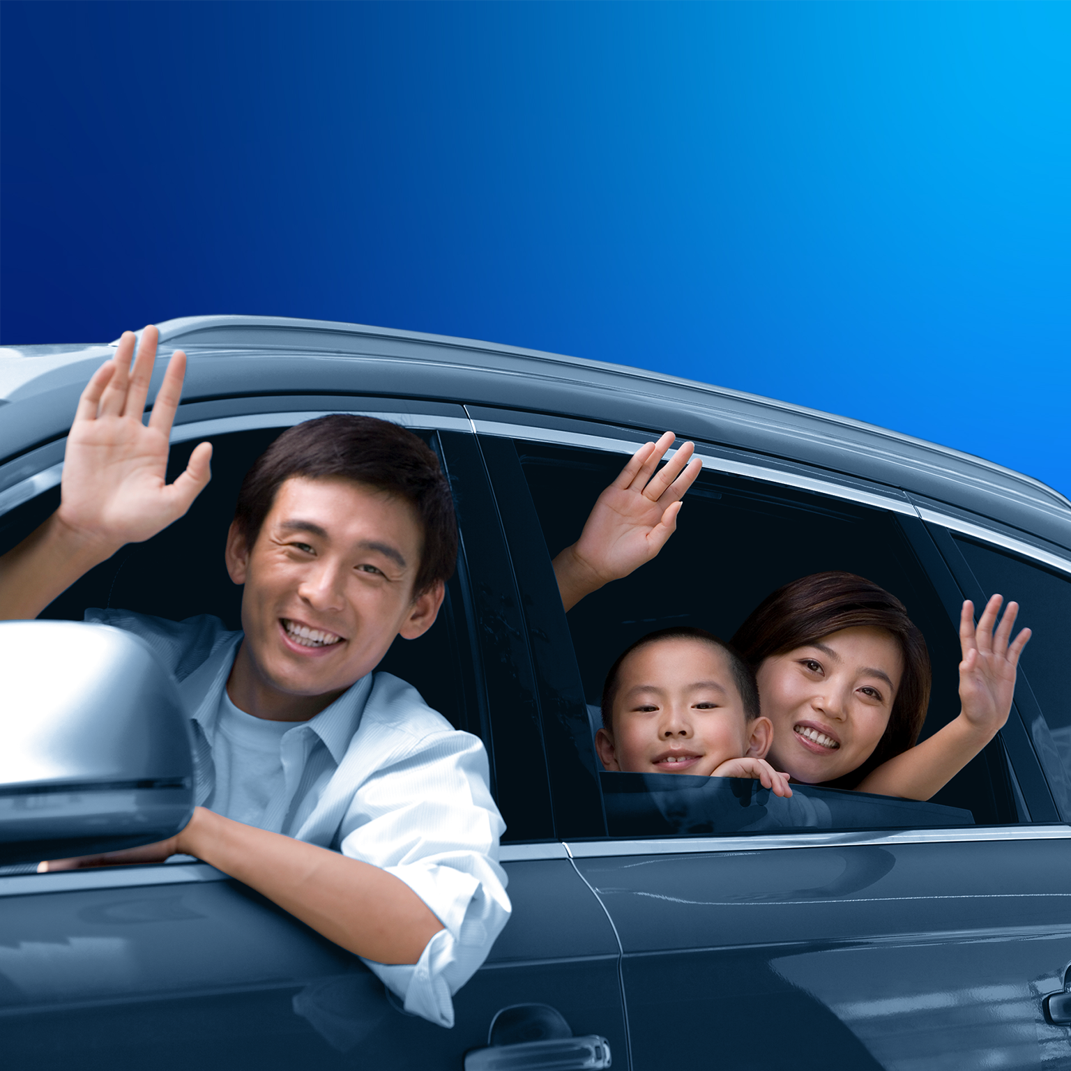 Family waving from a car