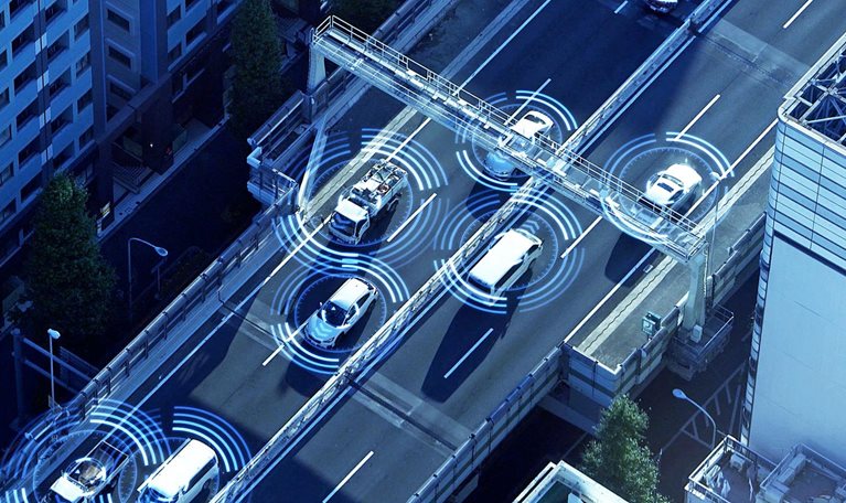 Aerial view of a multi-lane urban highway with illustrated digital sensor overlays on each vehicle.