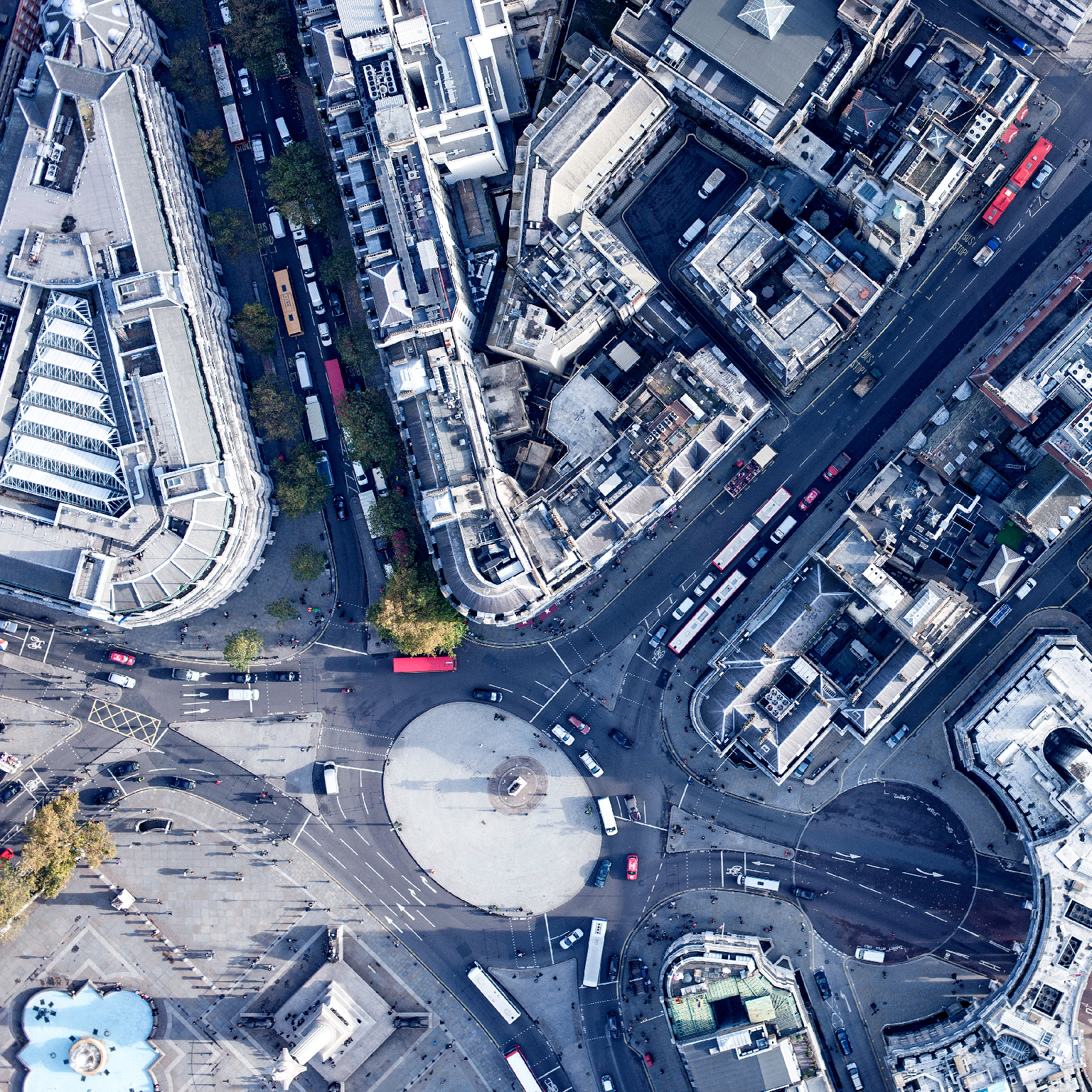 Directly above view of traffic circle amongst buildings, London, England, UK