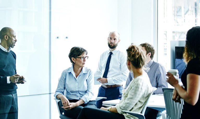 Businesswoman leading team meeting in office
