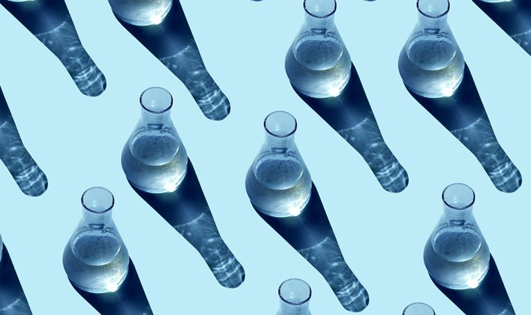 Seamless pattern made from glass beakers on a blue background.