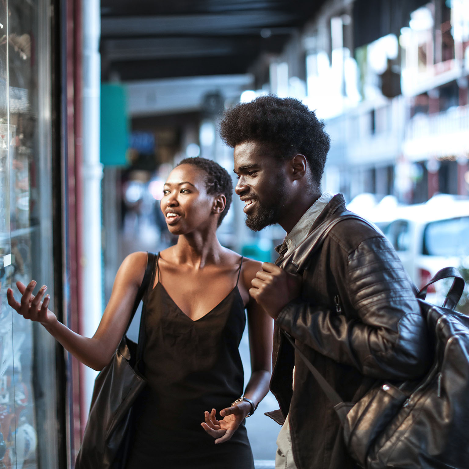 African couple window shopping