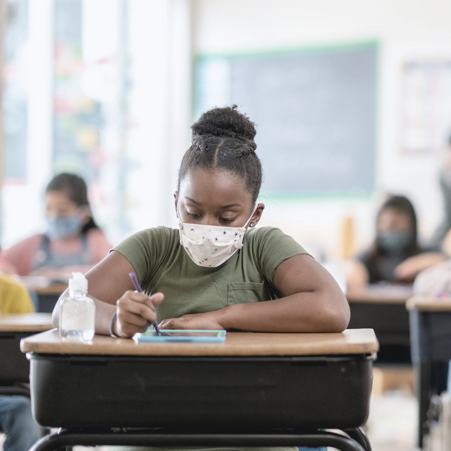 Student wearing mask at desk