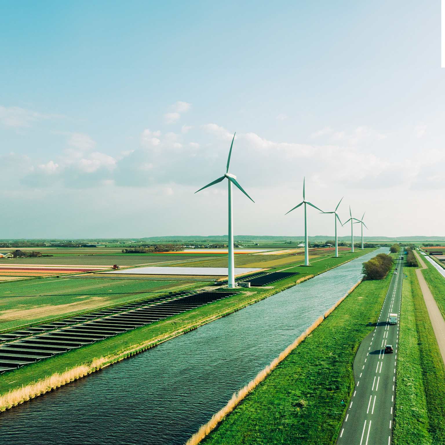 Solar panels and wind turbines generating renewable energy for green and sustainable future. - stock photo