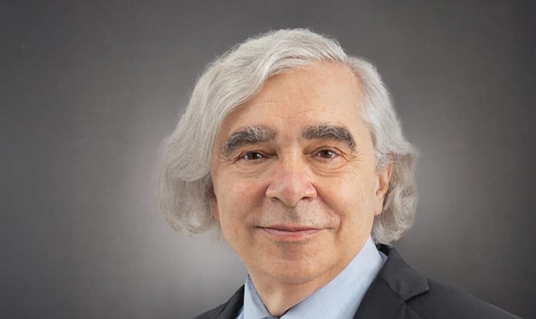 Smiling portrait photo of former US Energy Secretary Ernest Moniz