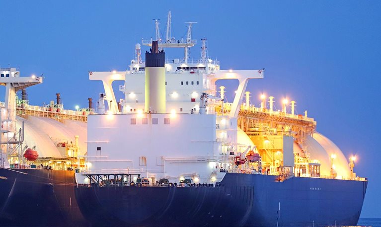 A liquified natural gas tanker supplying gas to a floating storage unit ship (LNG FSU) - stock photo