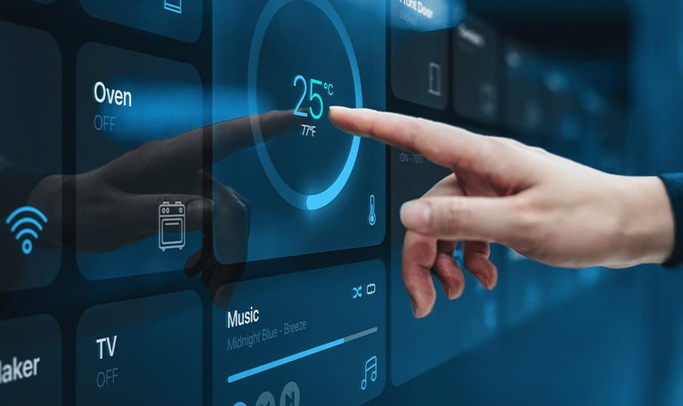 Close up of woman's hand setting up intelligent home system, controlling smart home appliances with control panel of a smart home.