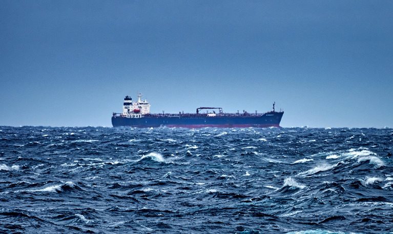 Ship delivering cargo in the stormy Mediterranean sea
