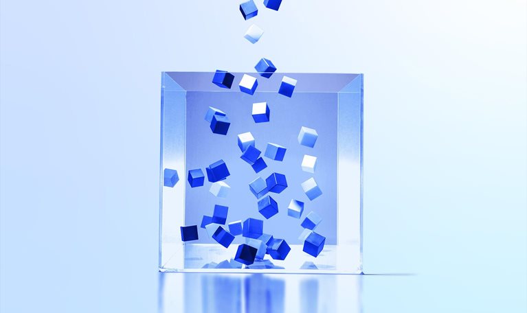 Image of multi colored cubes flowing out of clear box.